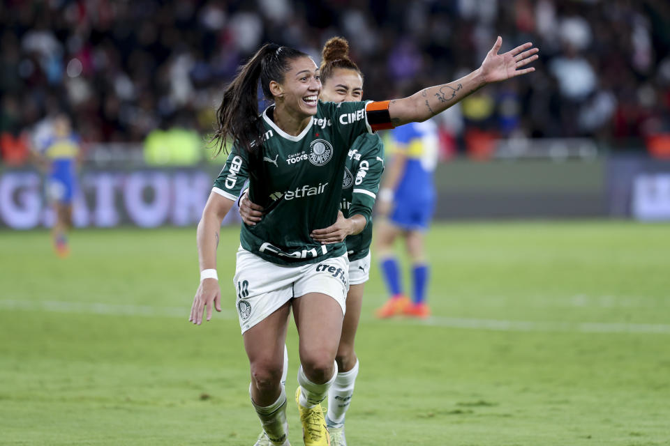 Bia Zaneratto of Brazil's Palmeiras, left, celebrates scoring her side's 4th goal against Argentina's Boca Juniors during the Copa Libertadores final soccer match in Quito, Ecuador, Friday, Oct. 28, 2022. (AP Photo/Cecilia Puebla)