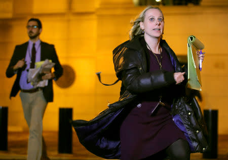 Reuters reporter Sarah N. Lynch rushes out of the Albert V. Bryan United States Courthouse after the sentencing of Paul Manafort, former campaign chairman of U.S. President Donald Trump's 2016 election campaign in Alexandria, Virginia, U.S., March 7, 2019. REUTERS/Jim Young