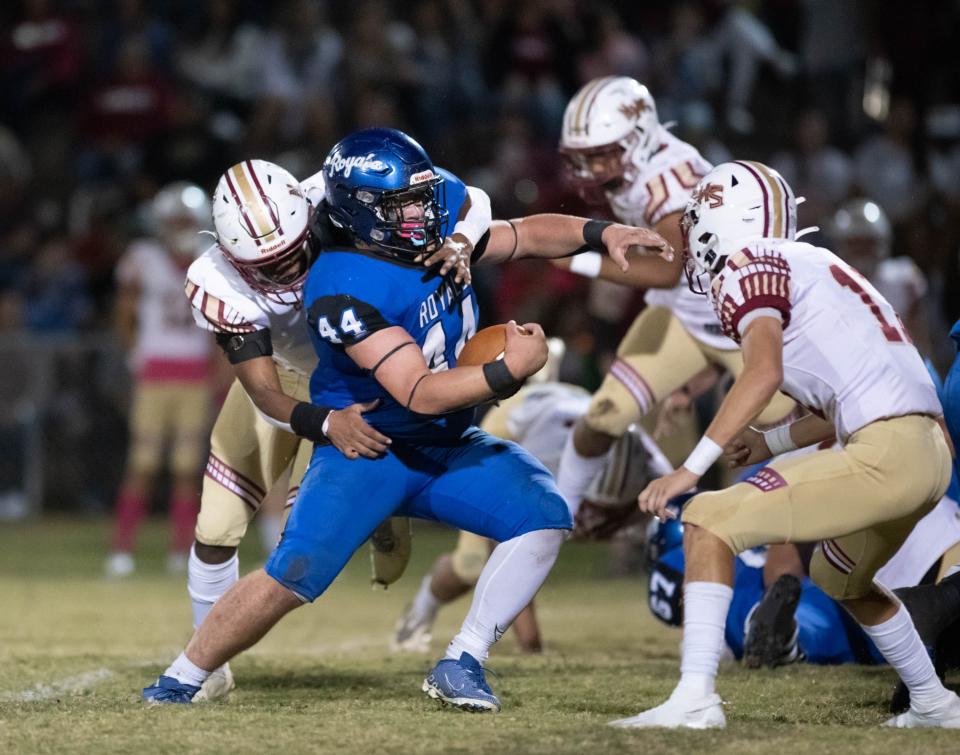 Joe Wright (9) begins to wrap up Landyn Cooley (44) during the Northview vs Jay football game at Jay High School in Jay on Friday, Oct. 14, 2022.