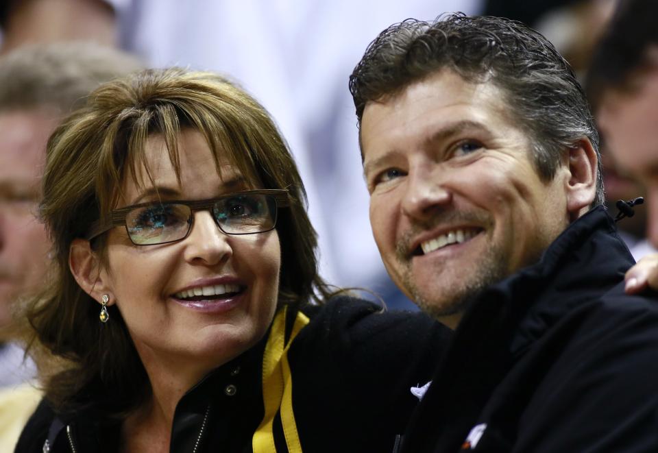 Sarah Palin and her husband, Todd, photographed at the NBA Eastern Conference final basketball playoff series in 2013. (Reuters/Brent Smith/File)