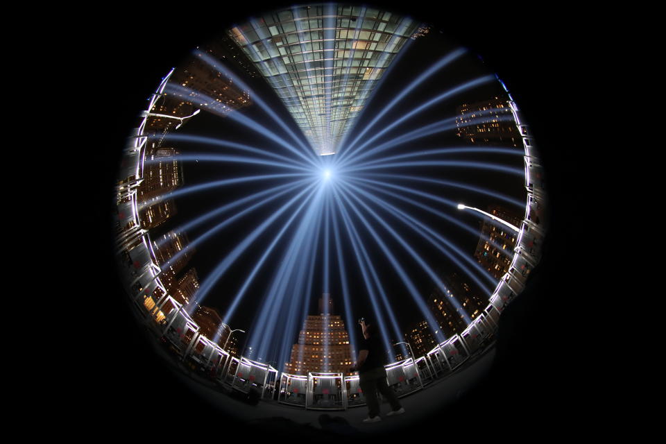 <p>Taken on his back using a fisheye lens, The Tribute in Light rises above the New York skyline from the National September 11 Memorial & Museum on Sept. 11, 2017. (Gordon Donovan/Yahoo News) </p>