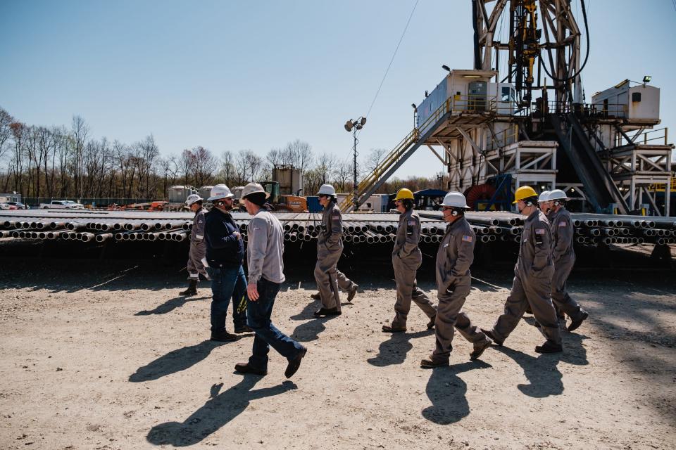 A group of Buckeye Career Center Energy Operations and Natural Resources students are seen during a learning tour at the Encino Energy Leeper rig and well pad on Thursday in Sherrodsville.
