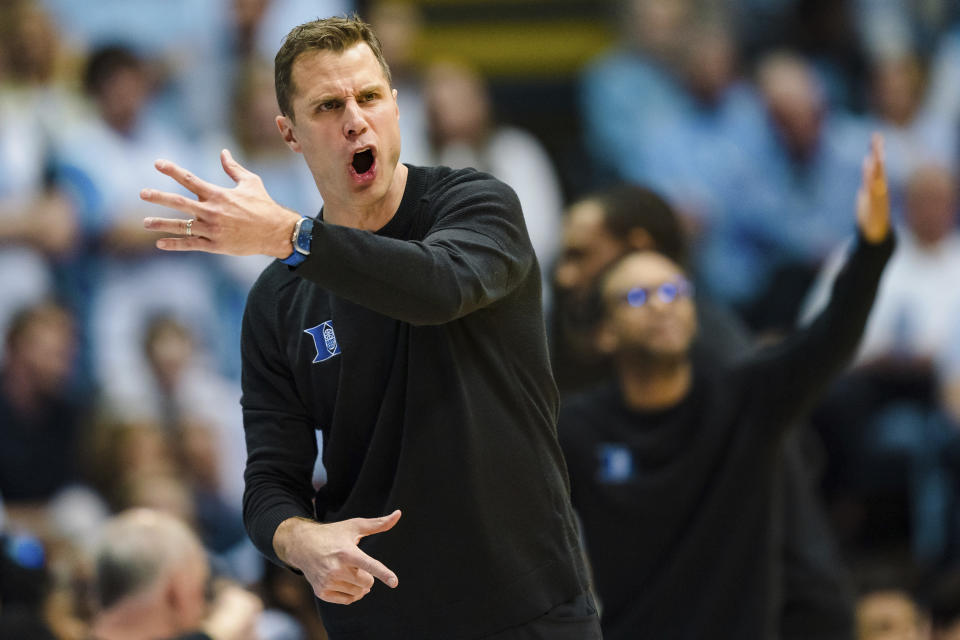 FILE - Duke head coach Jon Scheyer looks on during an NCAA college basketball game against North Carolina on Saturday, March 4, 2023, in Chapel Hill, N.C. Kansas is the preseason No. 1 in the AP men's college basketball poll, released Monday, Oct. 16, 2023. Duke picked up 11 first-place votes to land at No. 2 in Jon Scheyer's second season. (AP Photo/Jacob Kupferman, File)