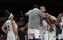 United States's Zachary Lavine (5) hugs teammate Kevin Durant (7) to celebrate after their win in the men's basketball semifinal game against Australia at the 2020 Summer Olympics, Thursday, Aug. 5, 2021, in Saitama, Japan. (AP Photo/Eric Gay)