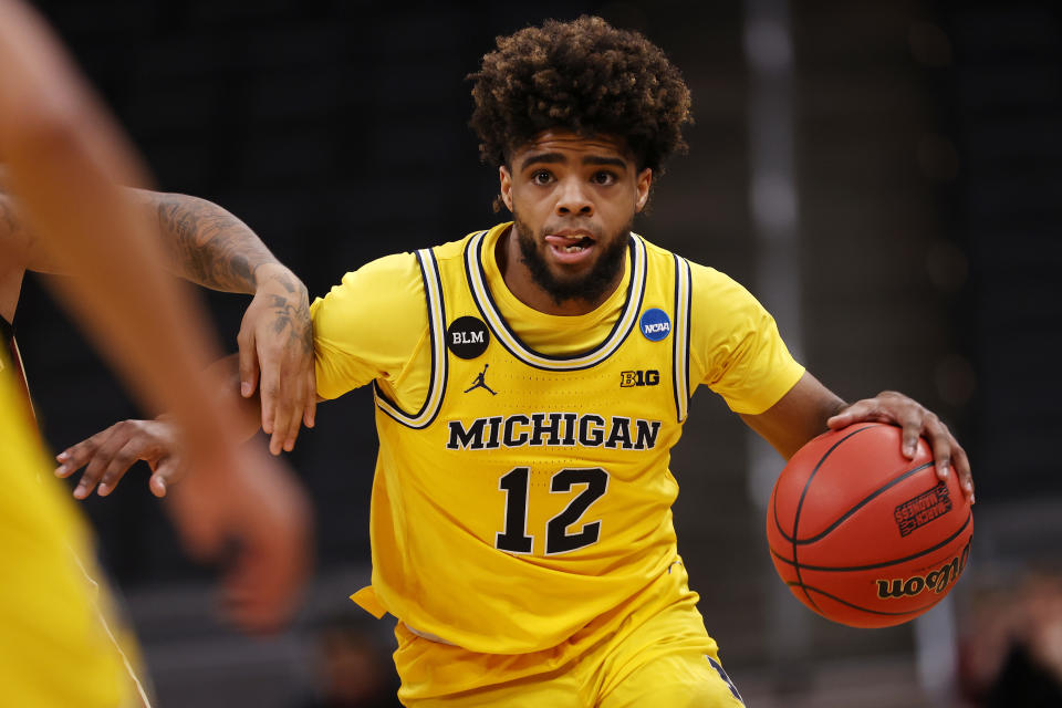 Mike Smith #12 of the Michigan Wolverines controls the ball against the Florida State Seminoles in the second half of their Sweet Sixteen round game of the 2021 NCAA Men's Basketball Tournament at Bankers Life Fieldhouse on March 28, 2021 in Indianapolis, Indiana. (Photo by Jamie Squire/Getty Images)