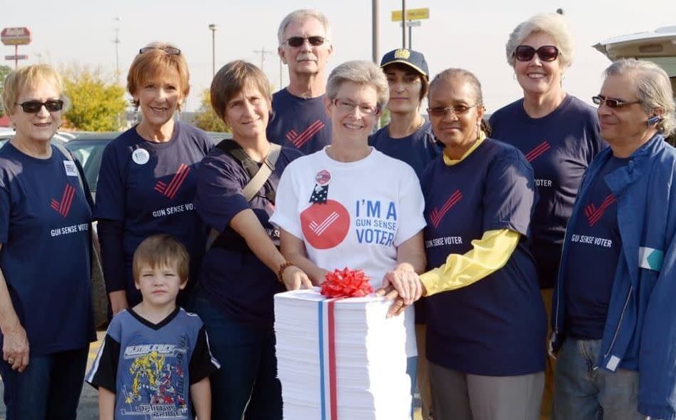 Michele Mueller, center, and other volunteers for Moms Demand Action took a giant stack of petitions to a Kroger in Cincinnati in 2014 to ask the grocery chain to stop allowing open carry. (Photo: Moms Demand Action)
