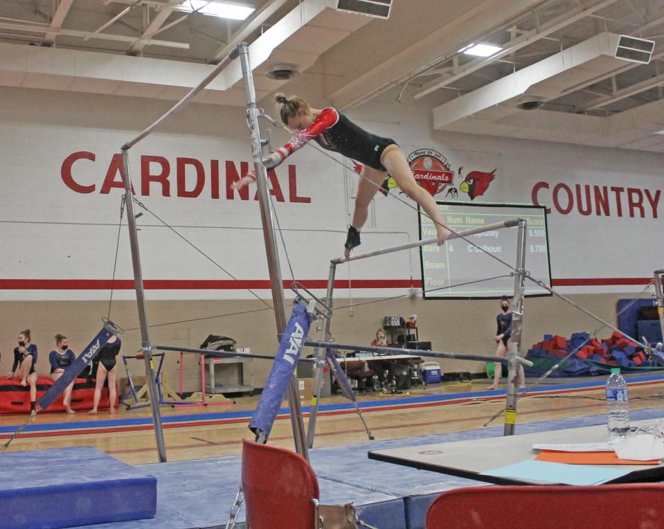 Coldwater's Randi Dudek performs on the Uneven Bars in early season action