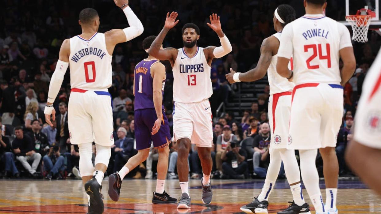 <div>Paul George #13 of the LA Clippers high fives Russell Westbrook #0, Terance Mann #14 and Norman Powell #24. (Photo by Christian Petersen/Getty Images)</div> <strong>(Getty Images)</strong>