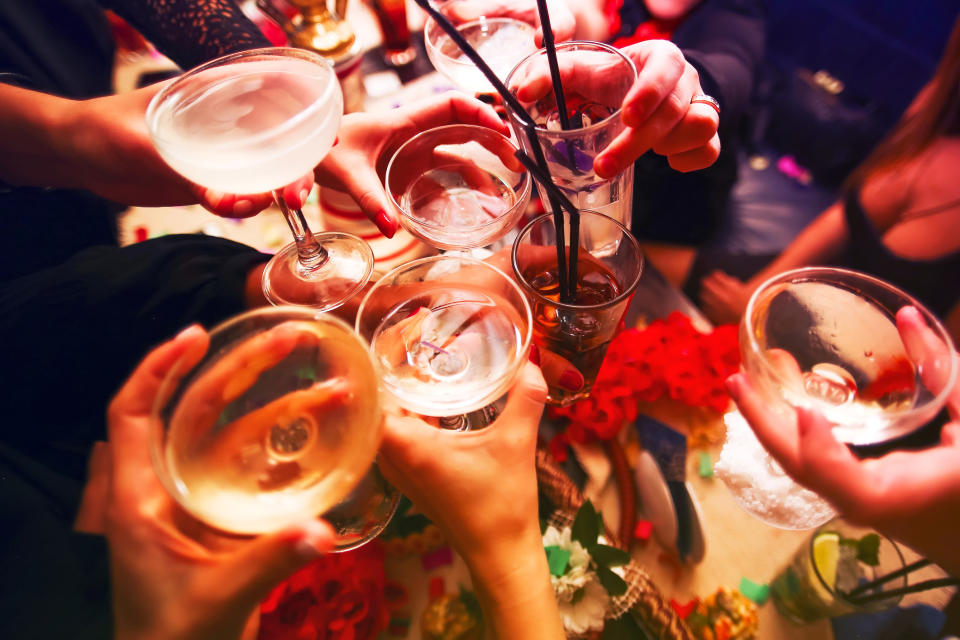 People toasting with an alcoholic drink. (Getty Images)