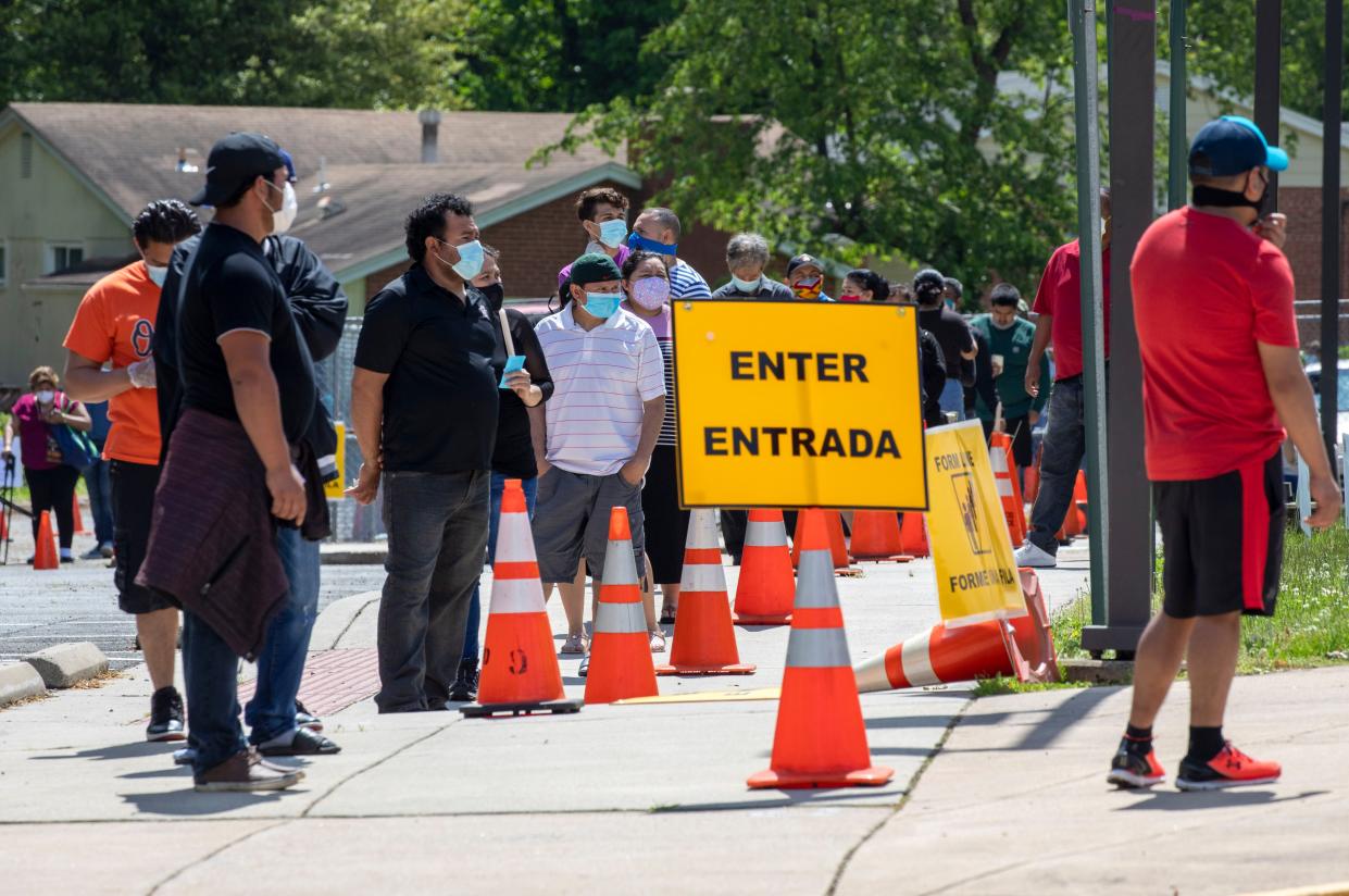 A line of hundreds of people forms outside of Annandale High School, along with a separate line for drive through testing, on Saturday, May 23, 2020, for COVID-19 testing available from Fairfax County in Virginia at no cost and without a doctor's order. Officials planned on testing about 1000 people. Testing will also be available at Bailey's Elementary on Sunday.