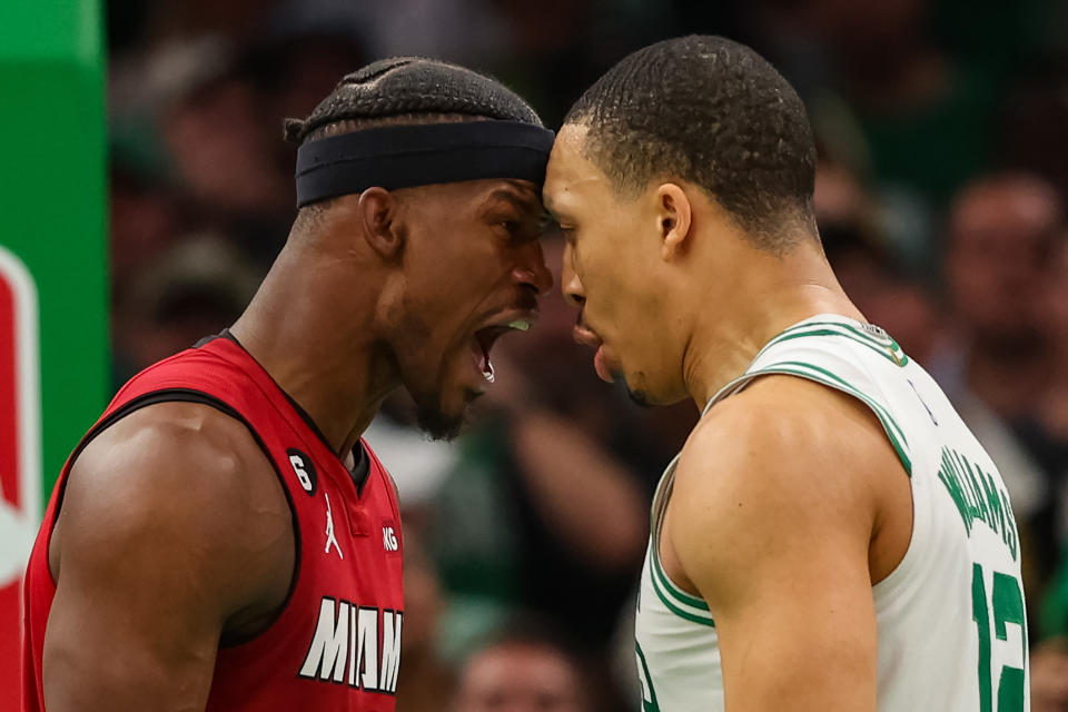Jimmy Butler of the Miami Heat exchanges words with Grant Williams of the Boston Celtics during the fourth quarter in Game Two of the Eastern Conference Finals at TD Garden on May 19, 2023, in Boston, Massachusetts.