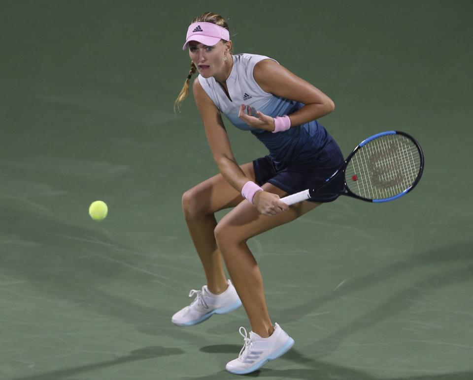 Kristina Mladenovic, of France, returns the ball to Naomi Osaka, of Japan, during a match of the Dubai Duty Free Tennis Championship in Dubai, United Arab Emirates, Tuesday, Feb. 19, 2019. (AP Photo/Kamran Jebreili)