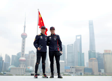 FILE PHOTO: Red Bull drivers Max Verstappen and Pierre Gasly attend a promotional event ahead of Chinese Grand Prix in Shanghai, China April 10, 2019. REUTERS/Aly Song