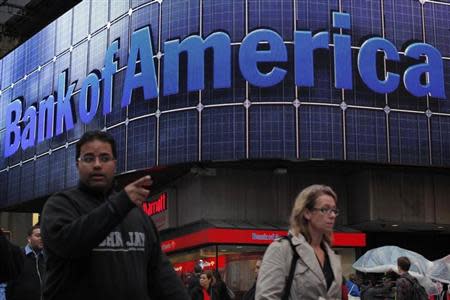 People walk next to a Bank of America's branch in New York October 24, 2012. REUTERS/Eduardo Munoz