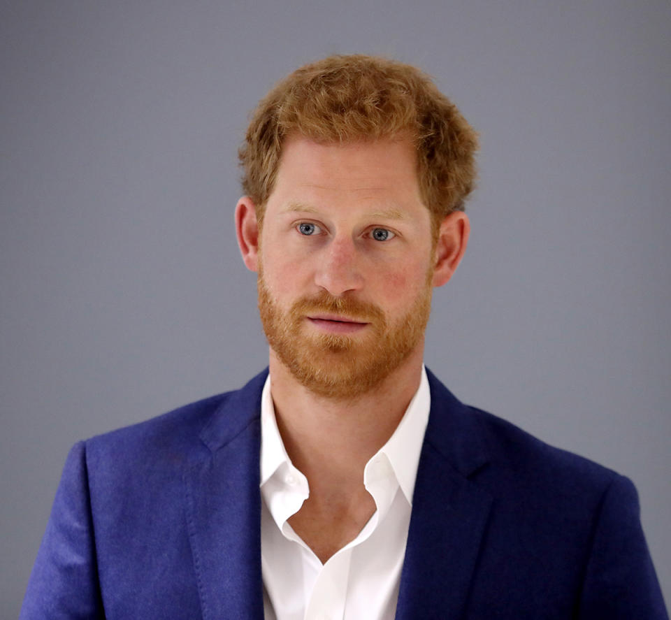 Prince Harry in a suit and open shirt