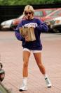 <p>Continuing her penchant for collegiate sweatshirts, Diana represented another American university, sporting a Northwestern sweatshirt and white shorts. Adding some luxury, Diana accessorized with a Gucci tote. </p>