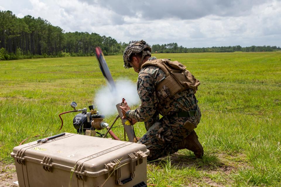 A Marine launches a Switchblade drone