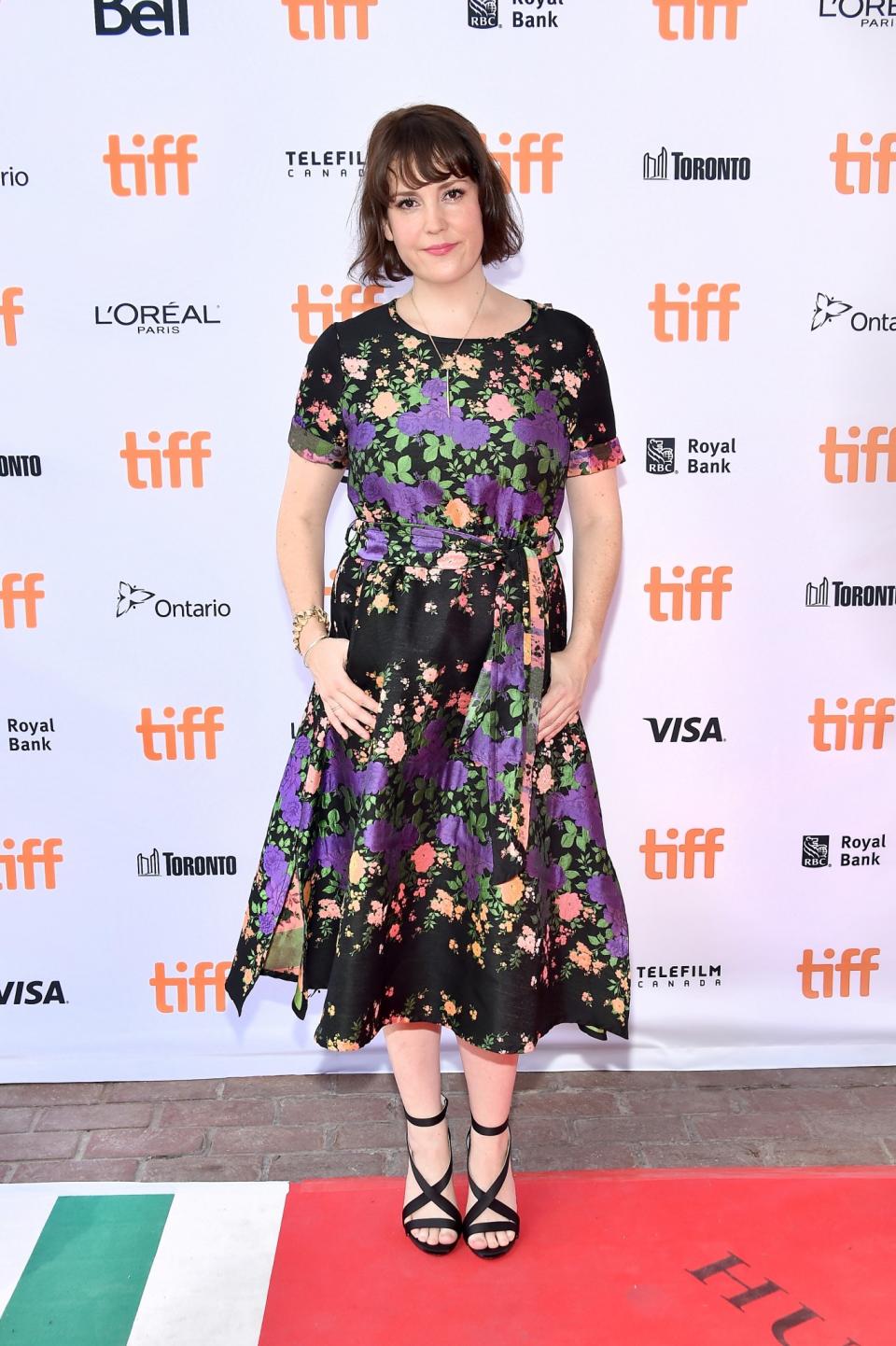 Melanie Lynskey in a black floral dress