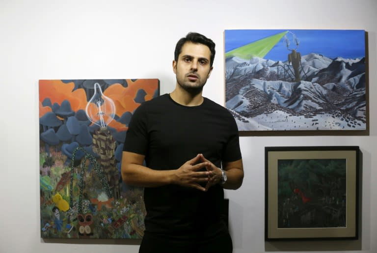 Hormuz Hematian, founder of the five-year-old Dastan Gallery in Tehran talks to AFP at his gallery