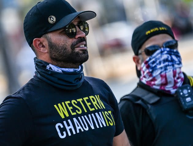 Enrique Tarrio wears a shirt supporting former police officer Derek Chauvin while people gathered in Miami to mark the anniversary of George Floyd's killing by Chauvin on May 25, 2021. (Photo: CHANDAN KHANNA/AFP via Getty Images)