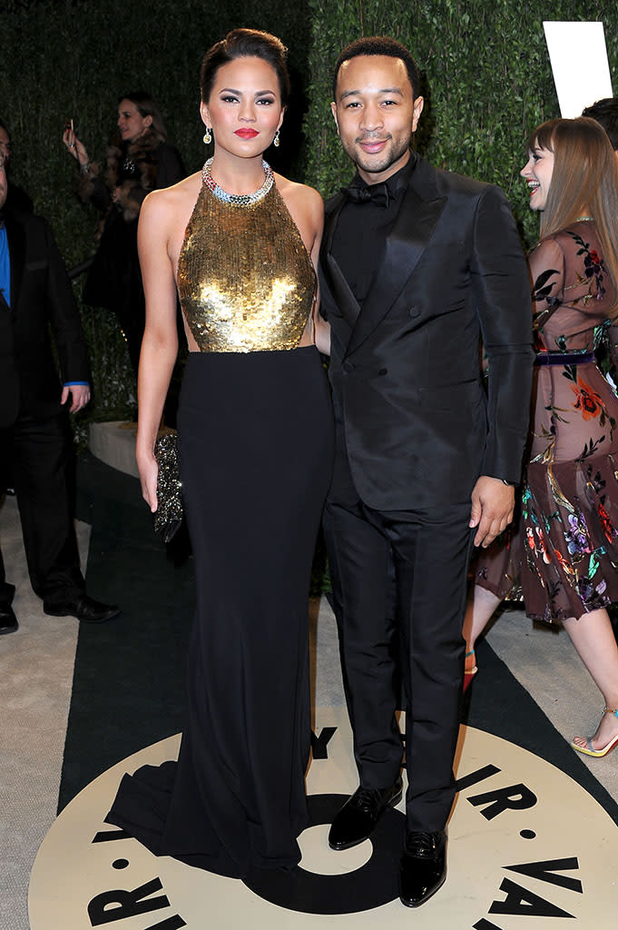 Chrissy Teigen and John Legend arrive at the 2013 Vanity Fair Oscar Party hosted by Graydon Carter at Sunset Tower on February 24, 2013 in West Hollywood, California.