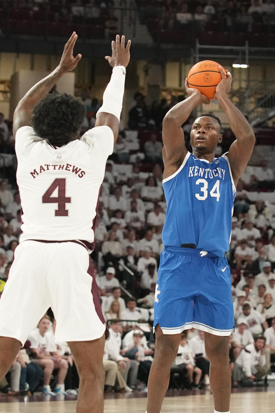 Kentucky forward Oscar Tshiebwe (34) shoots a basket over Mississippi State guard Cameron Matthews (4) during the first half of an NCAA college basketball game in Starkville, Miss., Wednesday, Feb. 15, 2023. (AP Photo/Rogelio V. Solis)
