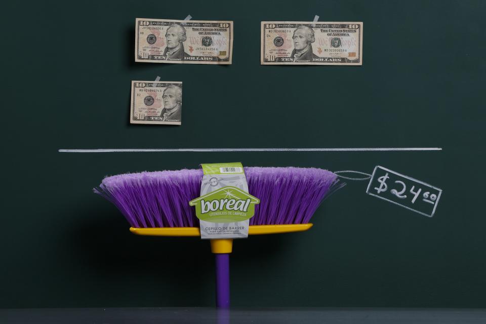 A household broom as photographed with an illustrative price tag of $24.60 in Caracas