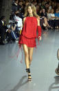 A young Gisele stood out on the Dolce & Gabbana runway in 2002 wearing a cherry red playsuit.