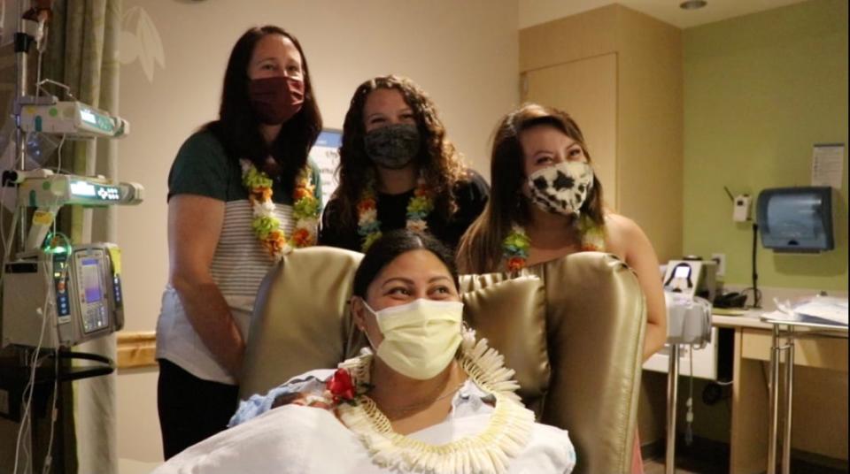 New mother, Lavinia Mounga with the three NICU nurses who helped her delivery on the plane.