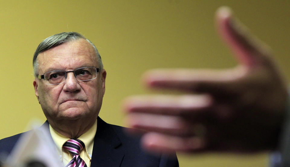 FILE - In this April 3, 2012 file photo, Maricopa County Sheriff Joe Arpaio listens to one of his attorneys during a news conference in Phoenix. Arpaio is expected to take the witness stand Tuesday, July 24, 2012, and face allegations that his trademark immigration sweeps amounted to racial profiling against Hispanics. (AP Photo/Ross D. Franklin, File)