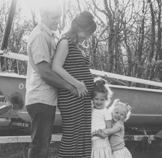 Abbey, pictured with husband Robert and daughters Dylan and Harper, was silently heartbroken when strangers would ask about her pregnancy.