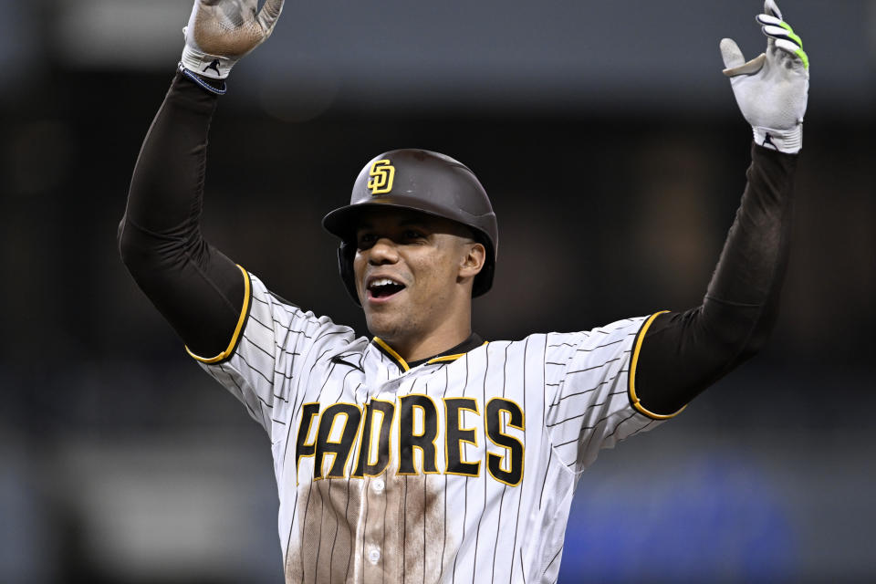 San Diego Padres' Juan Soto celebrates his two-run single during the eighth inning of the team's baseball game against the Colorado Rockies in San Diego, Saturday, April 1, 2023. (AP Photo/Alex Gallardo)