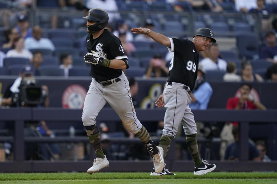 Chicago White Sox' AJ Pollock, left, runs the bases after hitting a go-ahead home run off New York Yankees relief pitcher Aroldis Chapman in the ninth inning of a baseball game, Sunday, May 22, 2022, in New York. (AP Photo/John Minchillo)