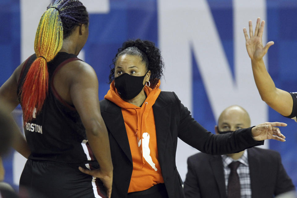 South Carolina's Aliyah Boston, left, receives instructions from South Carolina head coach Dawn Staley during the second half of an NCAA college basketball game against Kentucky in Lexington, Ky., Sunday, Jan. 10, 2021. (AP Photo/James Crisp)