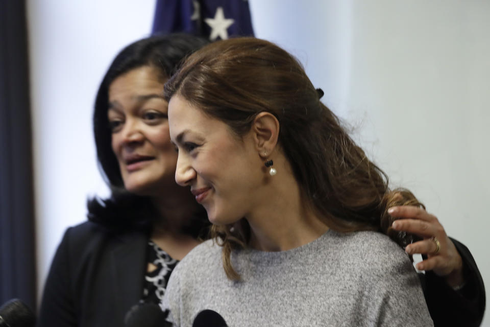 File - In this Jan 6, 2020, file photo, Rep. Pramila Jayapal, D-Wash., left, turns to Negah Hekmati after Hekmati spoke about her hours-long delay returning to the U.S. from Canada with her family days earlier, at a news conference in Seattle. U.S. Rep. Pramila Jayapal said Thursday, Jan. 30, she is working to authenticate an apparently leaked document showing that Customs and Border Protection agents on the U.S.-Canada border in Washington state were in fact ordered to detain Iranian and Iranian-American travelers early this month, despite initial agency denials. (AP Photo/Elaine Thompson, File)