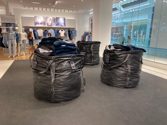 Trash bags filled with Yeezy clothes at a New Jersey Gap store on August 17, 2022.