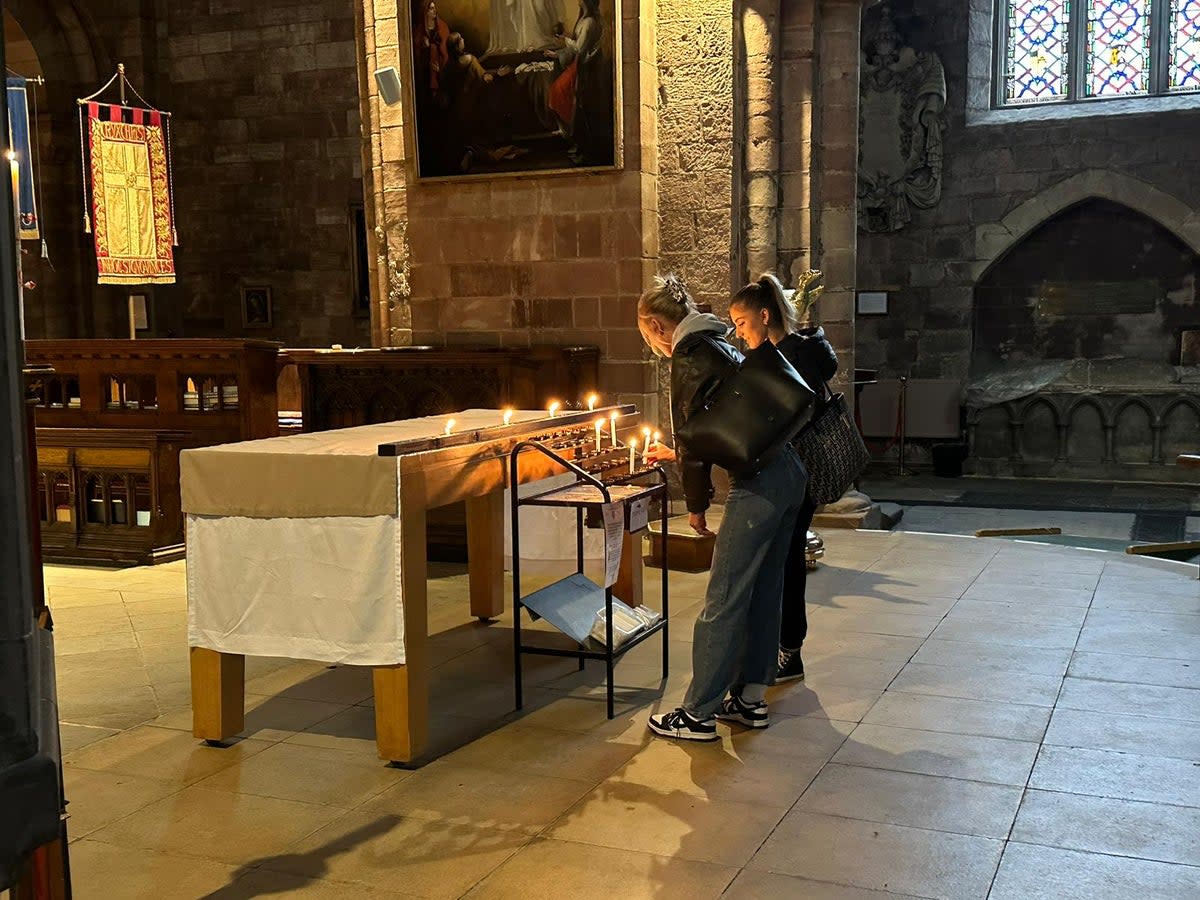 Candles were lit at Shrewsbury Abbey on Wednesday in remembrance of the teenagers (The Independent)