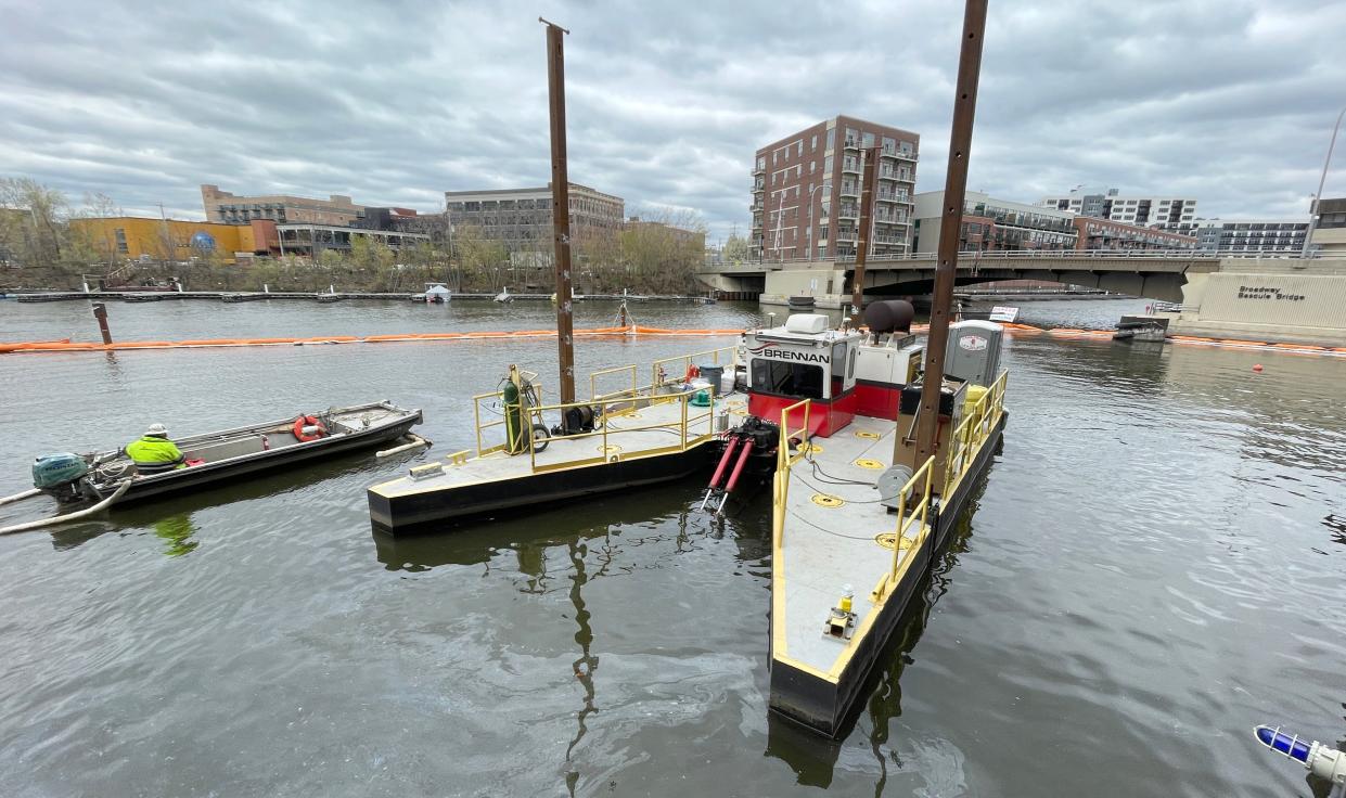 Dredging contaminated sediment takes place Tuesday, May 2, 2023 on the Milwaukee River along E. Erie St. in Milwaukee, Wis. The dredging will be paid for through $260 million in funding from the Great Lakes Legacy Act, which is administered by the Environmental Protection Agency.  Sediment will be dredged from 10.9 miles of the Milwaukee, Kinnickinnic and Menomonee Rivers. The estuary forms where the three rivers meet at Lake Michigan.