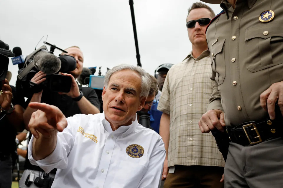 Texas Governor Greg Abbott speaks during a visit to the north banks of the Rio Grande in Eagle Pass, Texas, U.S. May 23, 2022. U.S. authorities, blocked by a federal judge from lifting COVID-19 restrictions that empower agents at the U.S.-Mexico border to turn back migrants, continue to enforce the Title 42 rules which result in the fast expulsion of migrants to Mexico or other countries. REUTERS/Marco Bello
