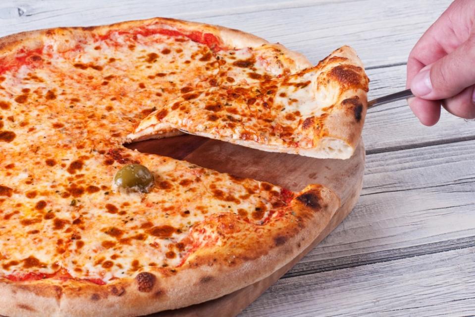 Despite having a wide variety of pizza and snacks, an uninvited guest wanted the host to order a different pie for her picky eater. Getty Images