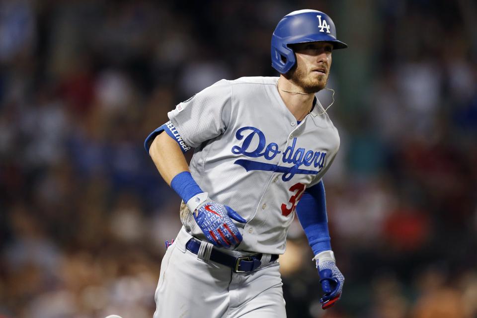 Los Angeles Dodgers' Cody Bellinger runs on his solo home run during the seventh inning of a baseball game against the Boston Red Sox in Boston, Saturday, July 13, 2019. (AP Photo/Michael Dwyer)