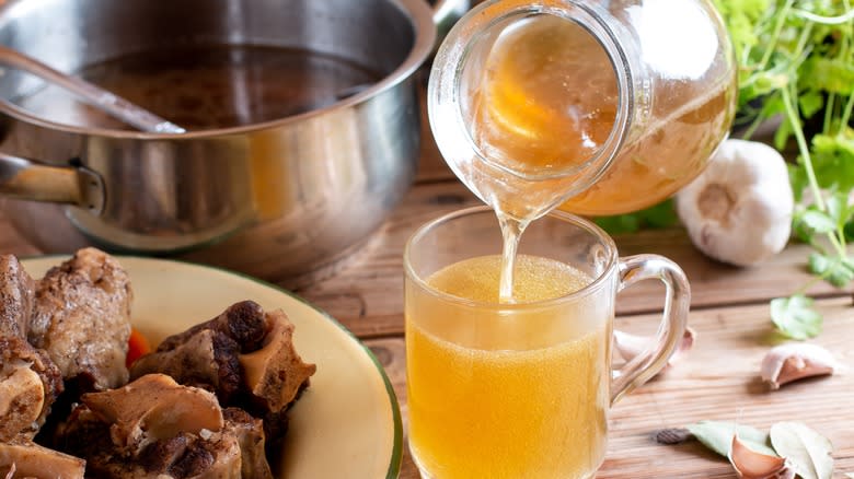 pouring broth into glass