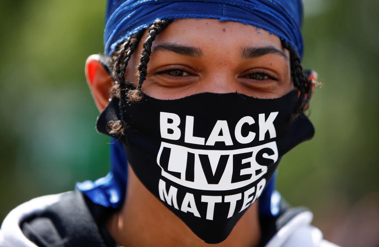 A demonstrator wears a face mask during a Black Lives Matter protest at Marble Arch, in London, Britain, July 12, 2020. REUTERS/Henry Nicholls