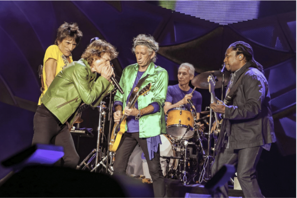 Bassist Darryl Jones (R) plays in concert with The Rolling Stones