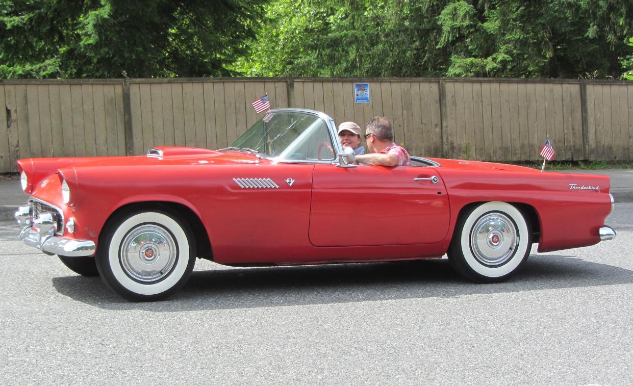 Red 1955 Ford Thunderbird with American flags