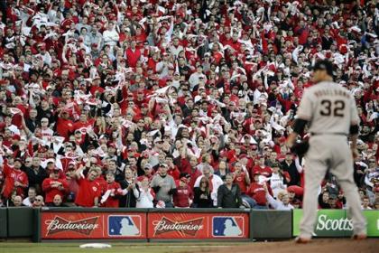 Reds fans wave anything they can find as Ryan Vogelsong prepares to pitch. (AP)