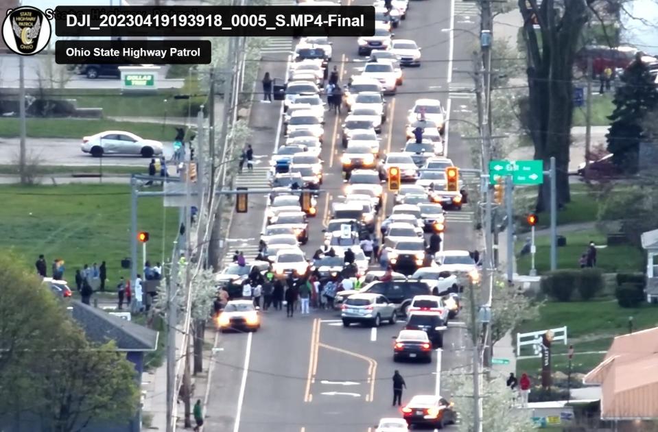 All three lanes of Copley Road are blocked by protesters, a caravan of vehicles supporting them and other vehicles trying to get through the area shortly before law enforcement arrives on April 19.