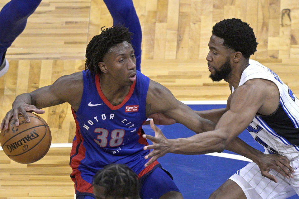 Detroit Pistons guard Saben Lee (38) sets up for a shot in front of Orlando Magic guard Chasson Randle (25) during the first half of an NBA basketball game, Tuesday, Feb. 23, 2021, in Orlando, Fla. (AP Photo/Phelan M. Ebenhack)