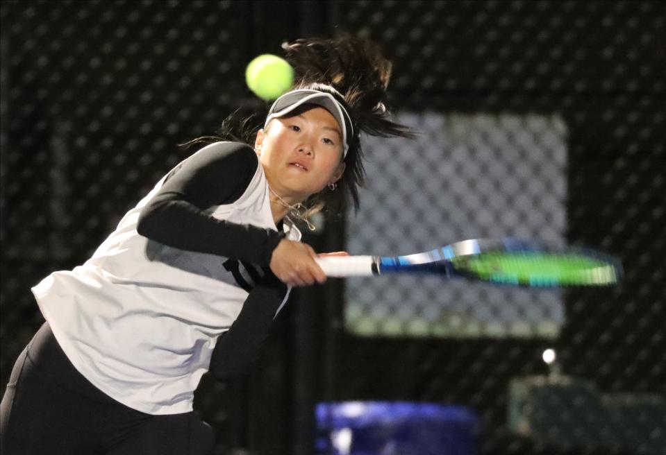 Scarsdale's Natalie Hu  returns a shot to Harrison's Hannah Rose during the Section One Division One girls tennis team finals at Harrison High School, Oct. 18, 2022. 