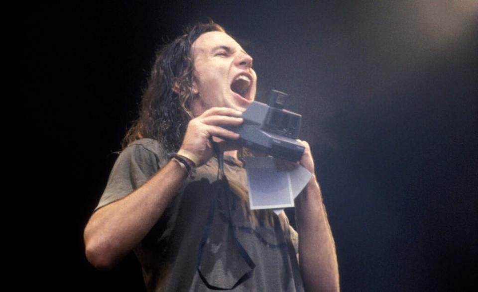 Vedder on stage with Pearl Jam at Pinkpop Festival in Landgraaf, Netherlands, June 1992. (Credit: Frans Schellekens/Redferns)